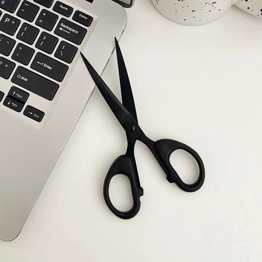 Black stainless steel scissors, designed for DIY crafting with sharp blades and durable handles. Perfect for cutting various materials with ease.