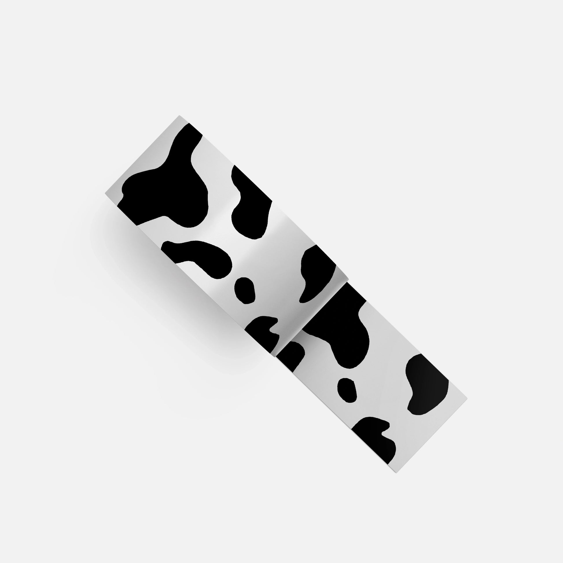 Black and white cow-pattern tape, an essential accessory to complement the Kawaii Cow Bunny phone case stickers, adding extra flair and style.