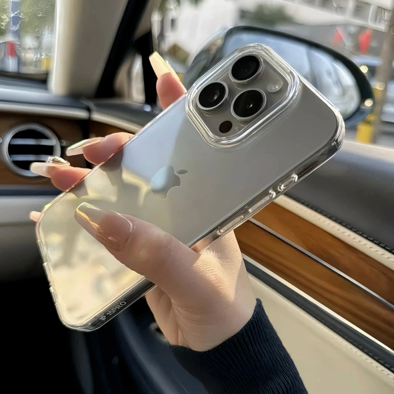 Person holding Clear Phone Case with Cyber Metal Stickers applied, showcasing the modern, sleek design.