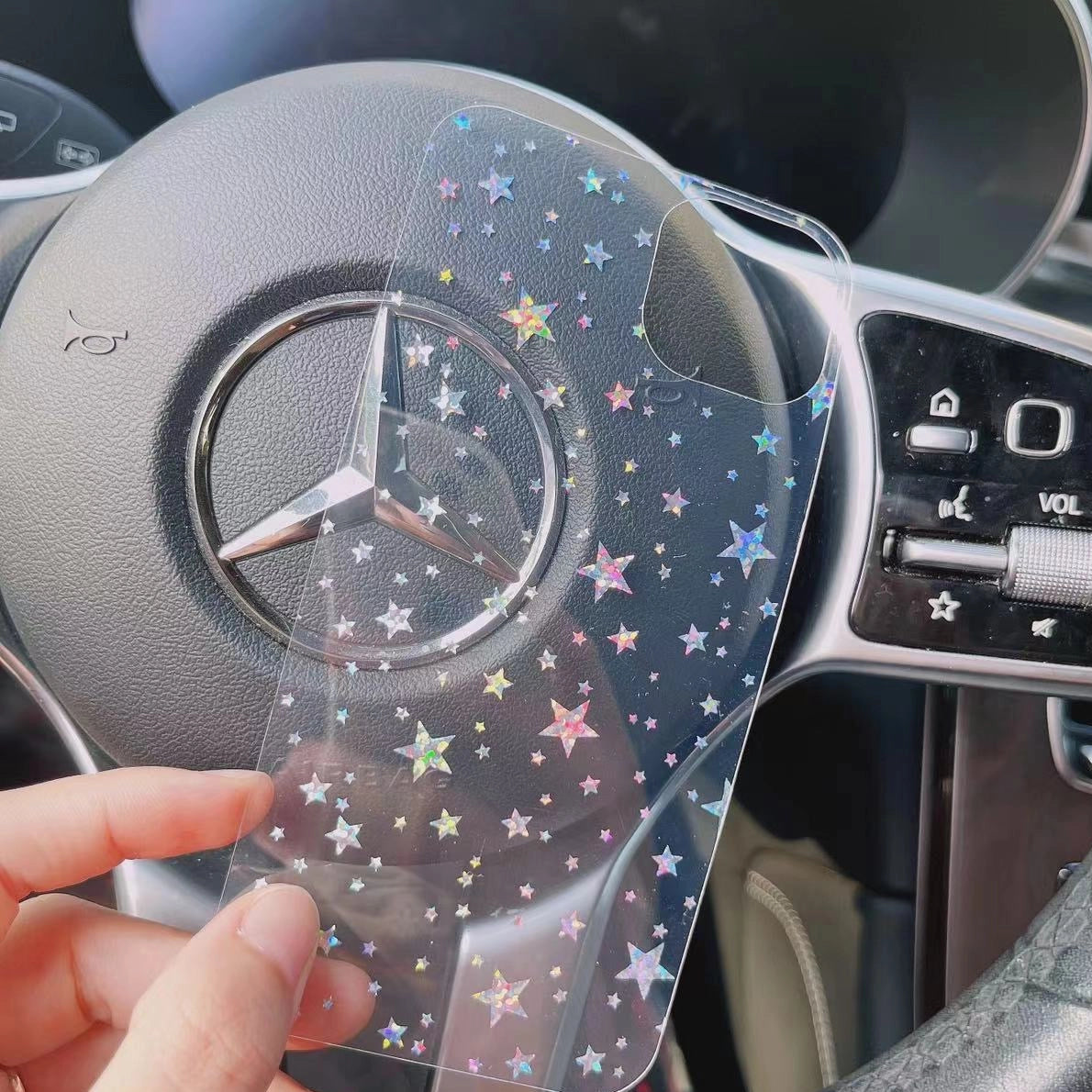 Real-life photo of the holographic star back decor card, showcasing its shimmering star pattern and iridescent finish for a unique phone case look.