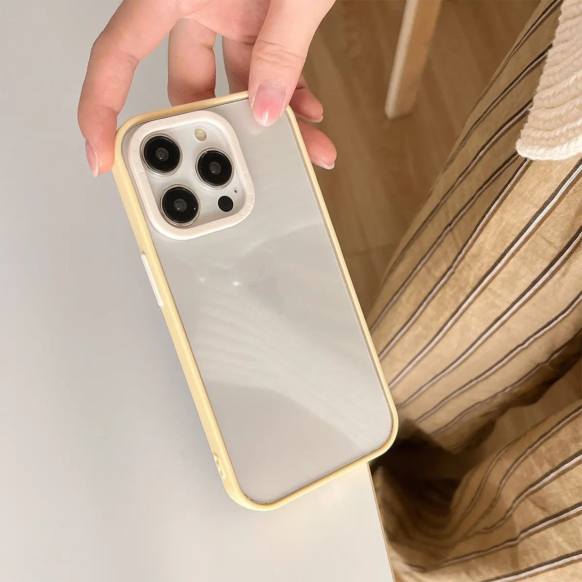 Macaron color block phone case with a bold contrast frame, offering a minimalistic and fashionable design for everyday use.